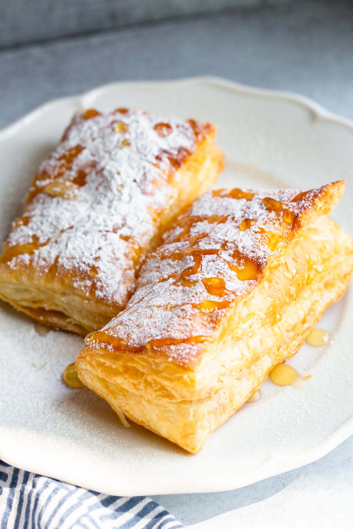 Air fried puff pastry with powdered sugar and honey.