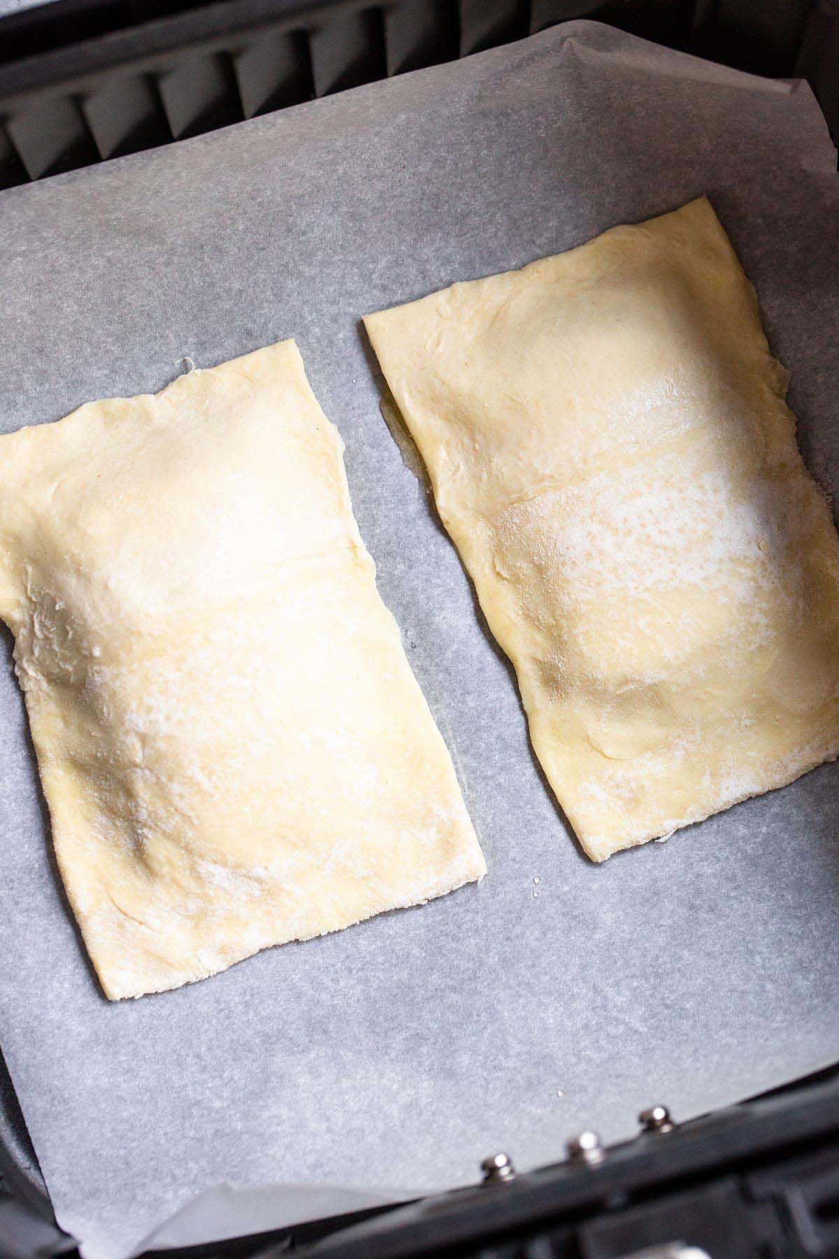 Uncooked puff pastry in air fryer.