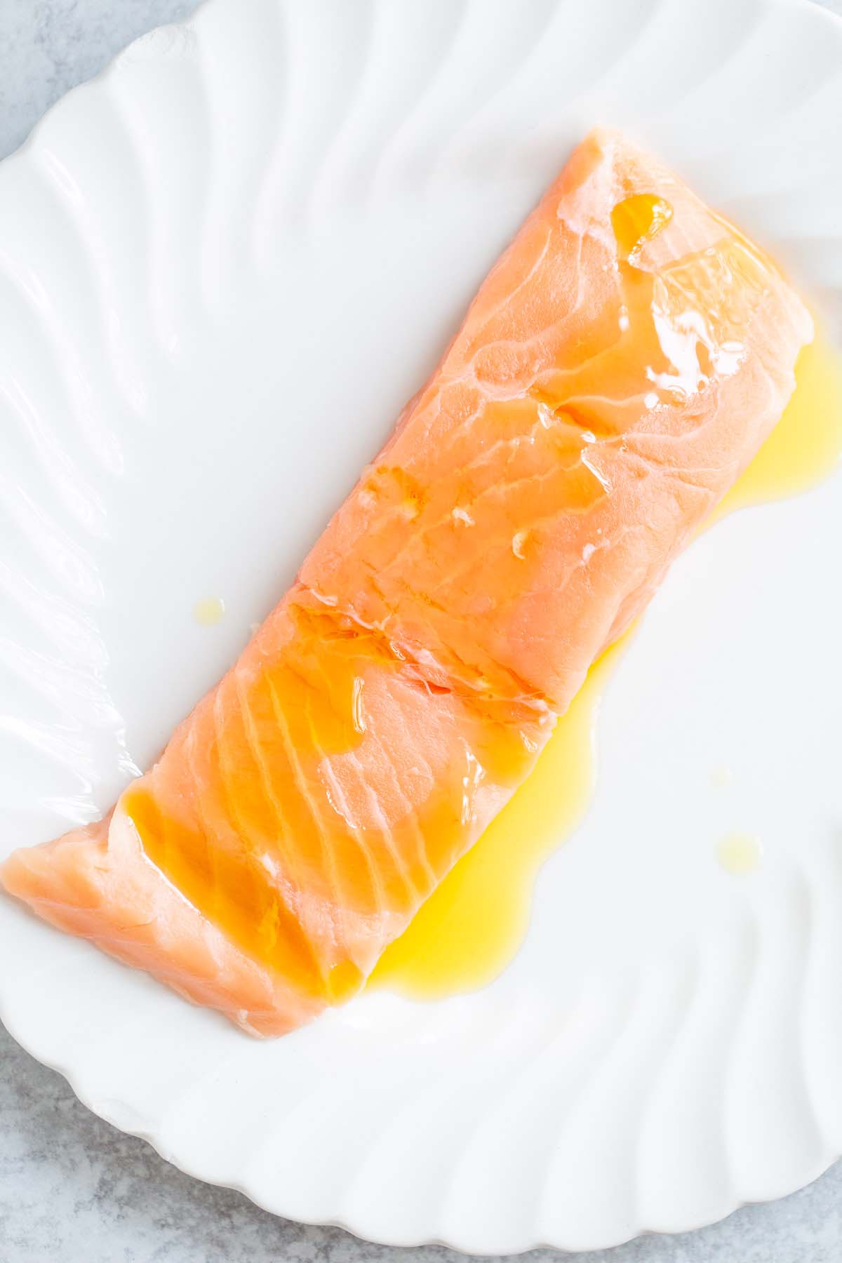 Salmon drizzled with olive oil.