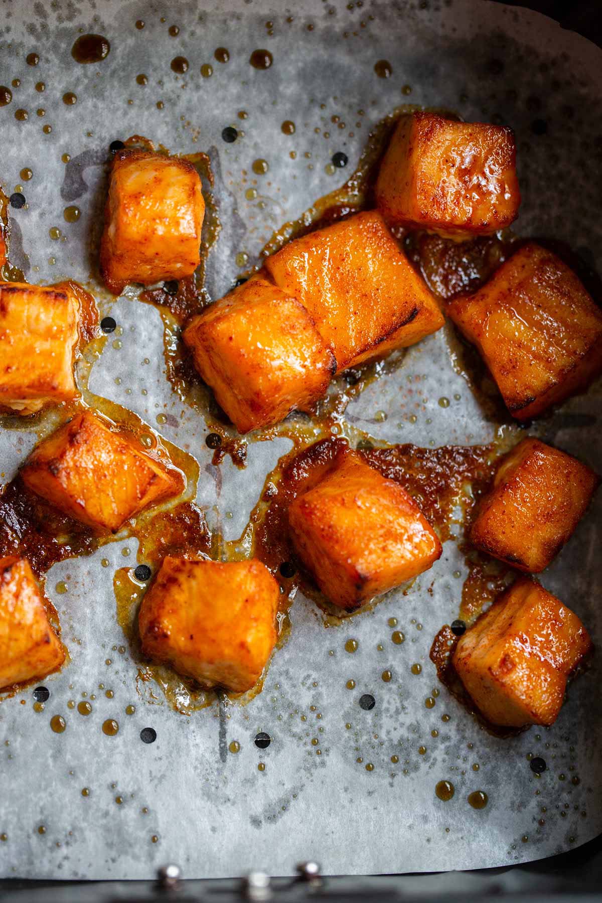 Salmon bites n air fryer basket.