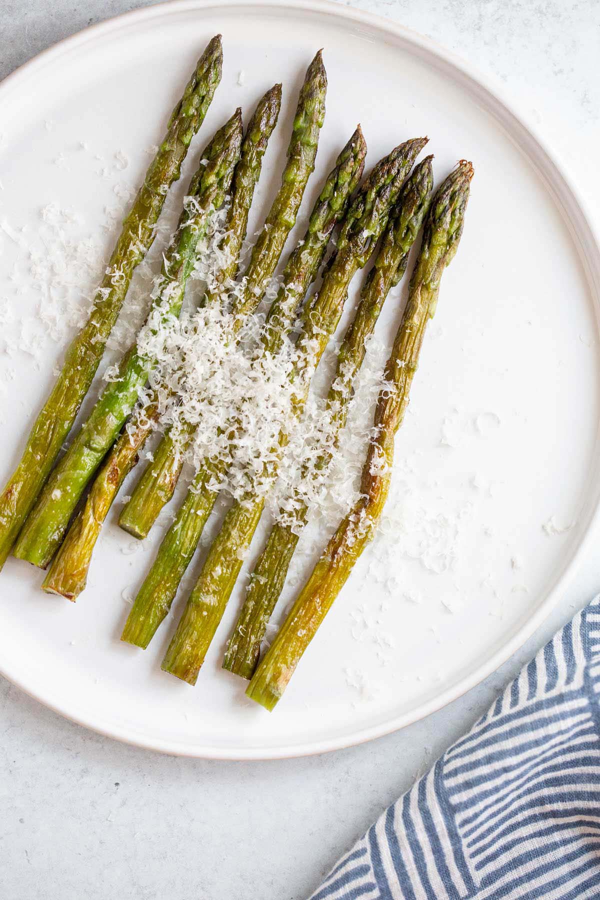 Air fried asparagus topped with parmesan cheese.