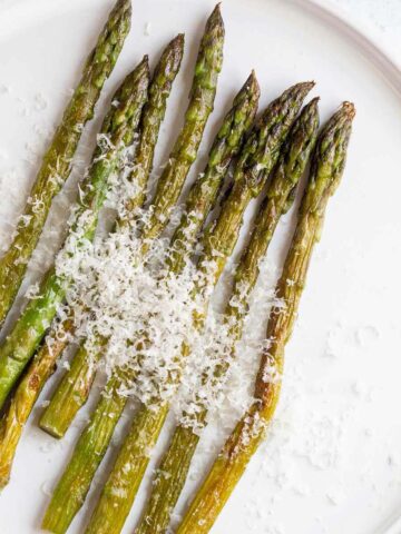 Air fried asparagus topped with parmesan cheese.