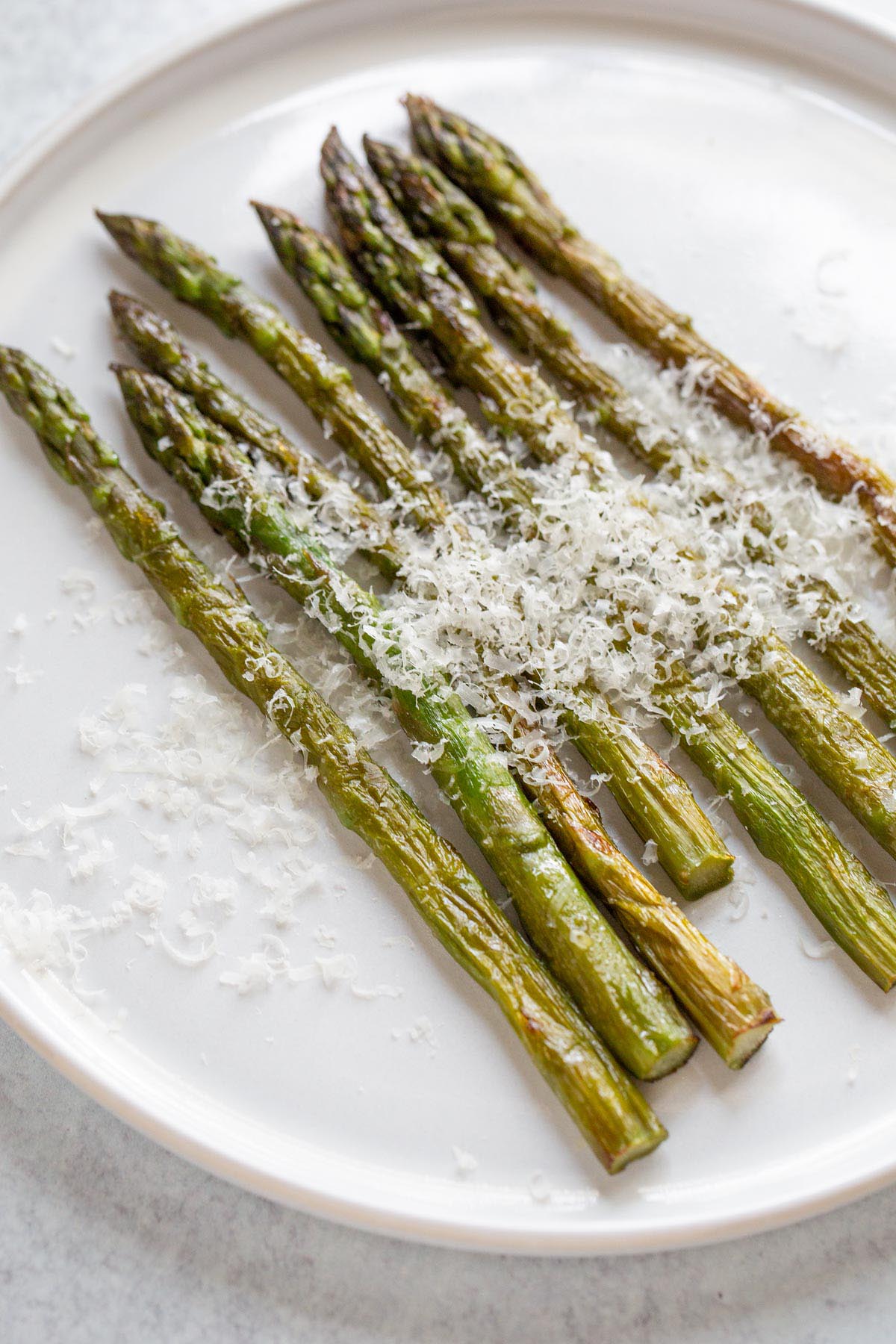 Air fried asparagus topped with parmesan cheese.