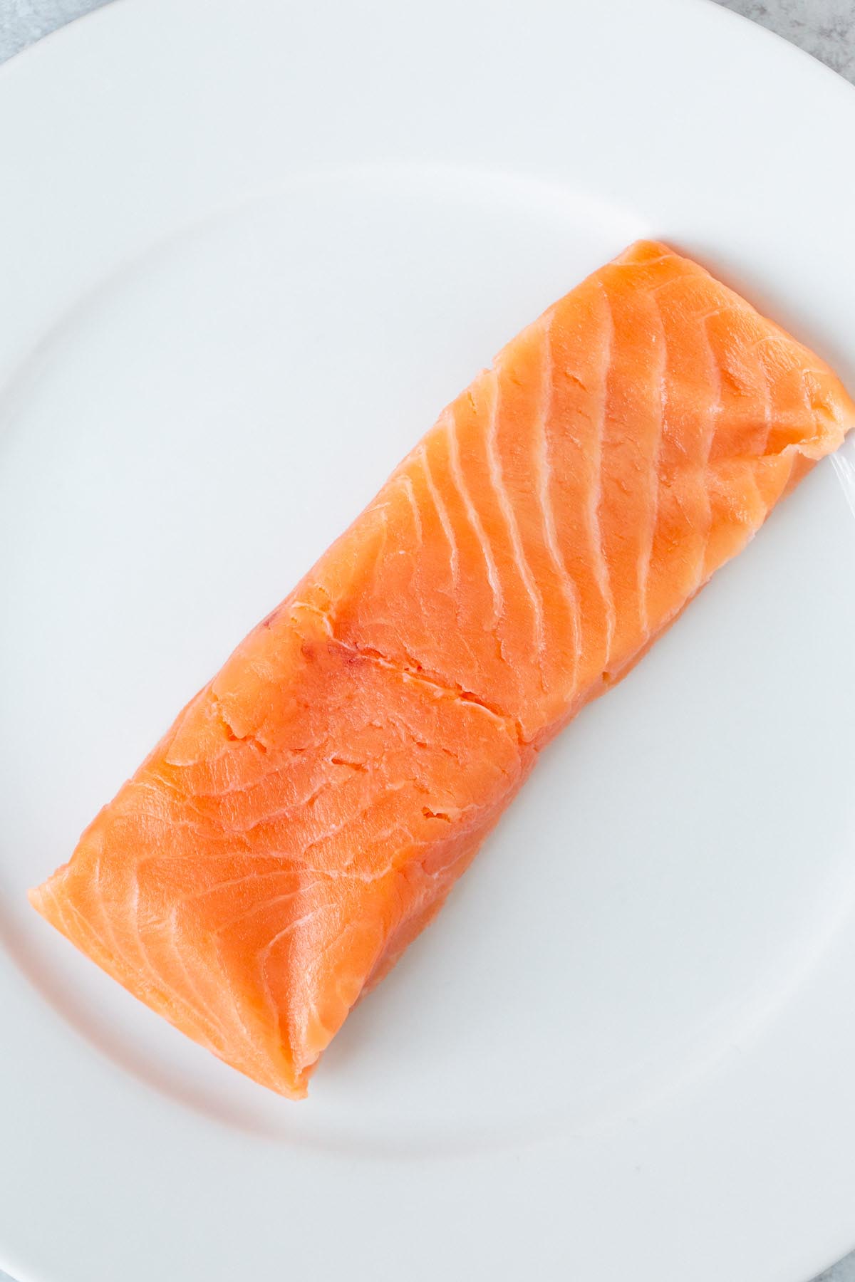 Raw salmon on a plate.