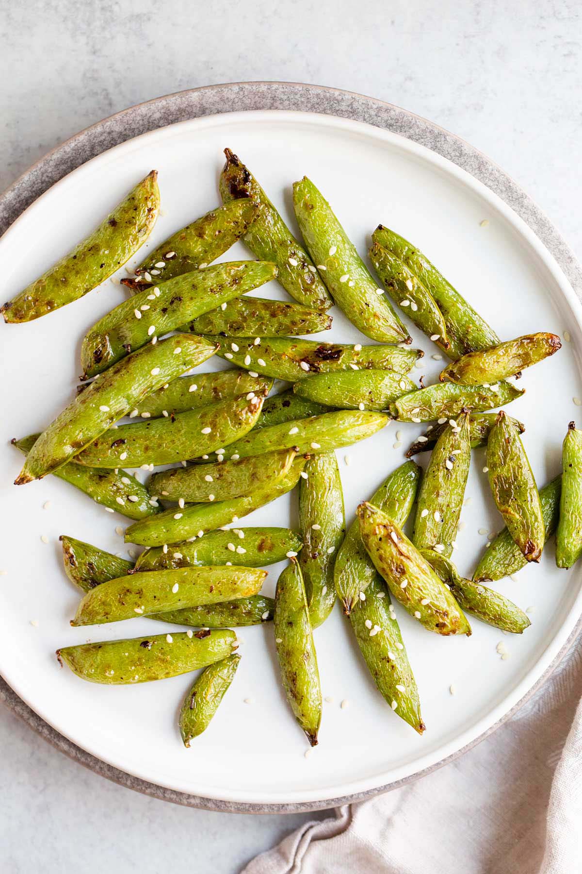 Air fried snap peas with sesame seeds.