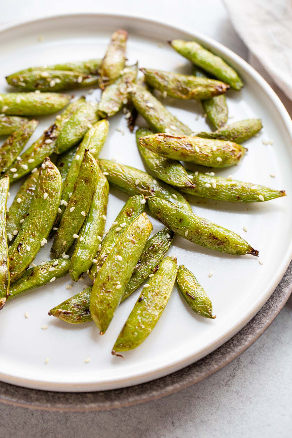 Air fried snap peas with sesame seeds.
