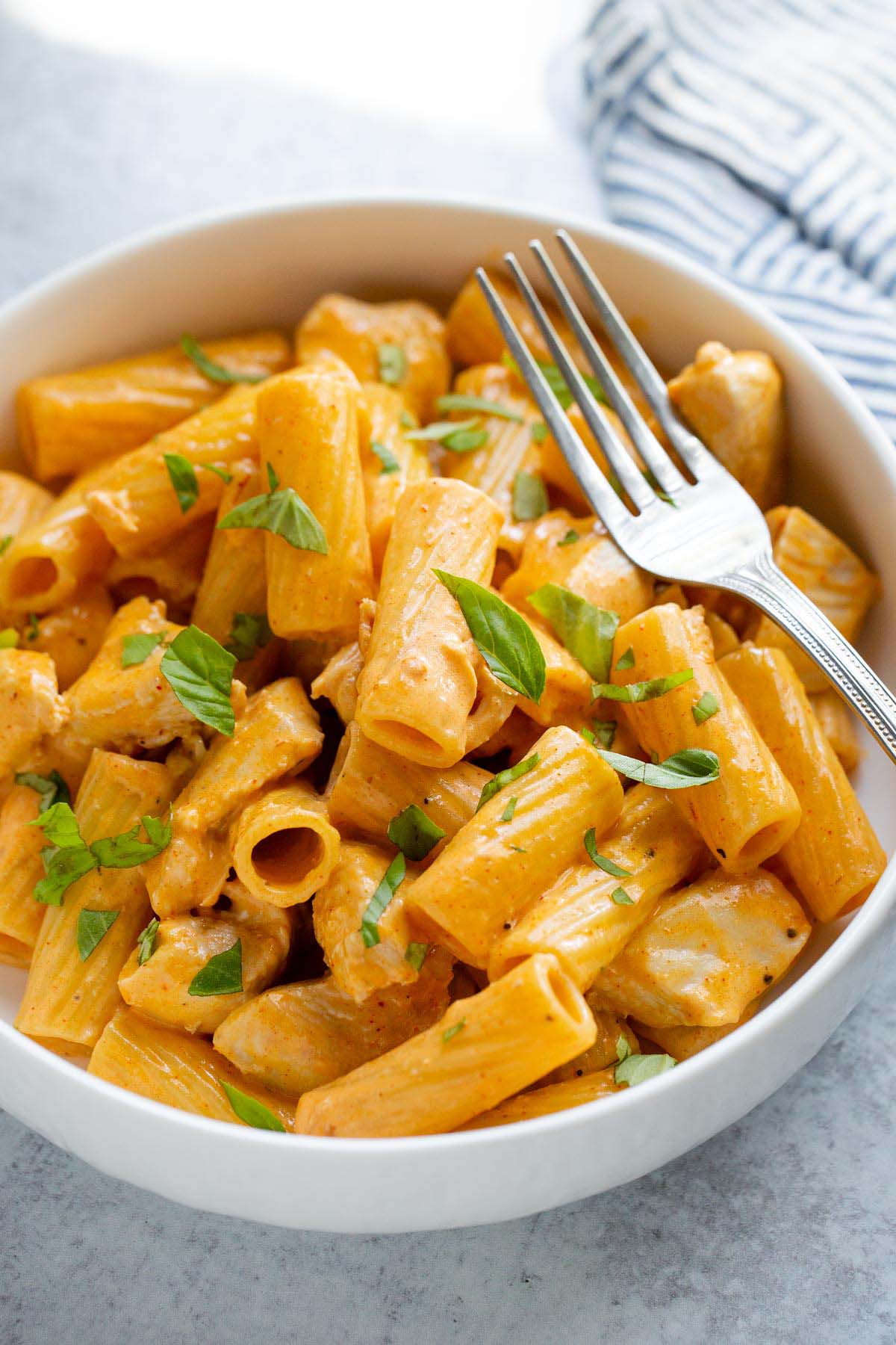 Peri peri pasta in a bowl with a fork