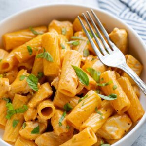 Peri peri pasta in a bowl with a fork