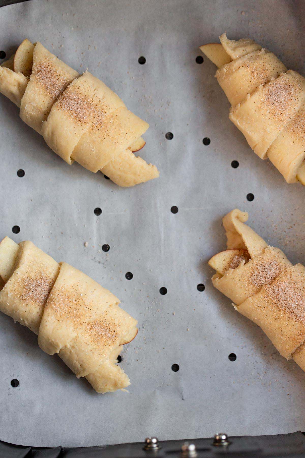 Uncooked apple pie crescent rolls in air fryer