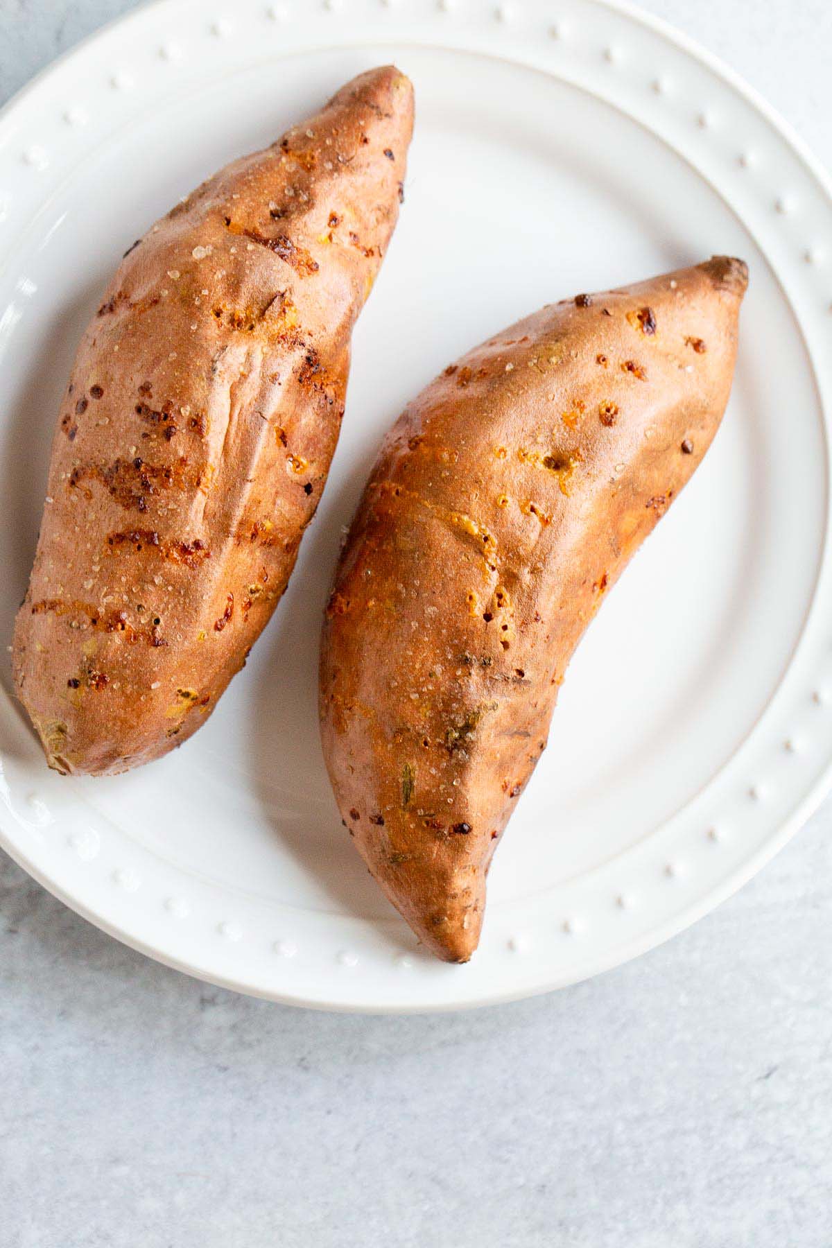 Baked sweet potato on a plate.