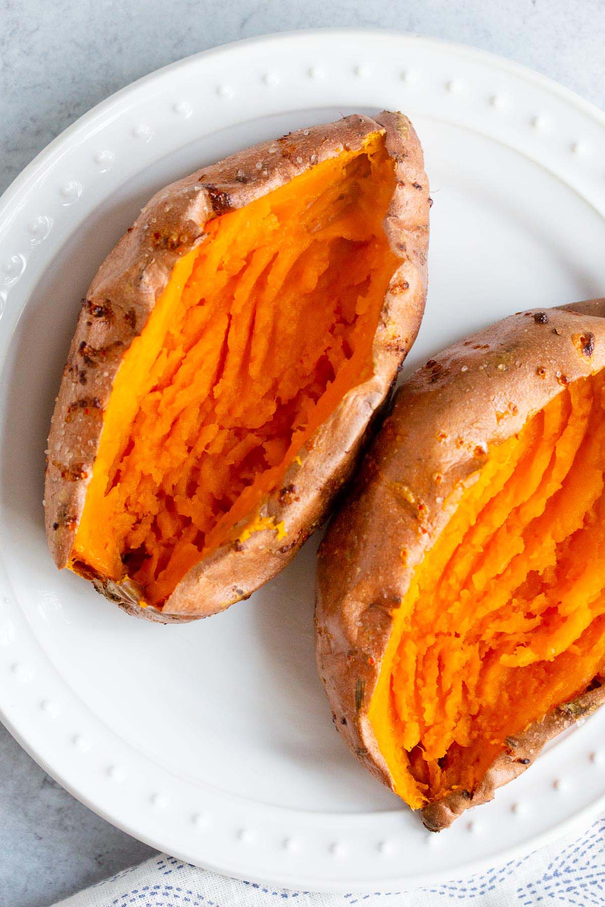 Baked sweet potato on a plate.