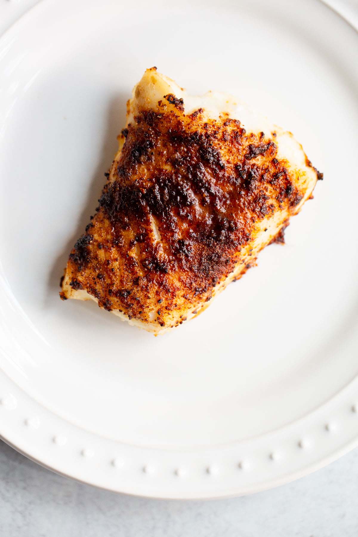 Air fried chili cod on a plate.