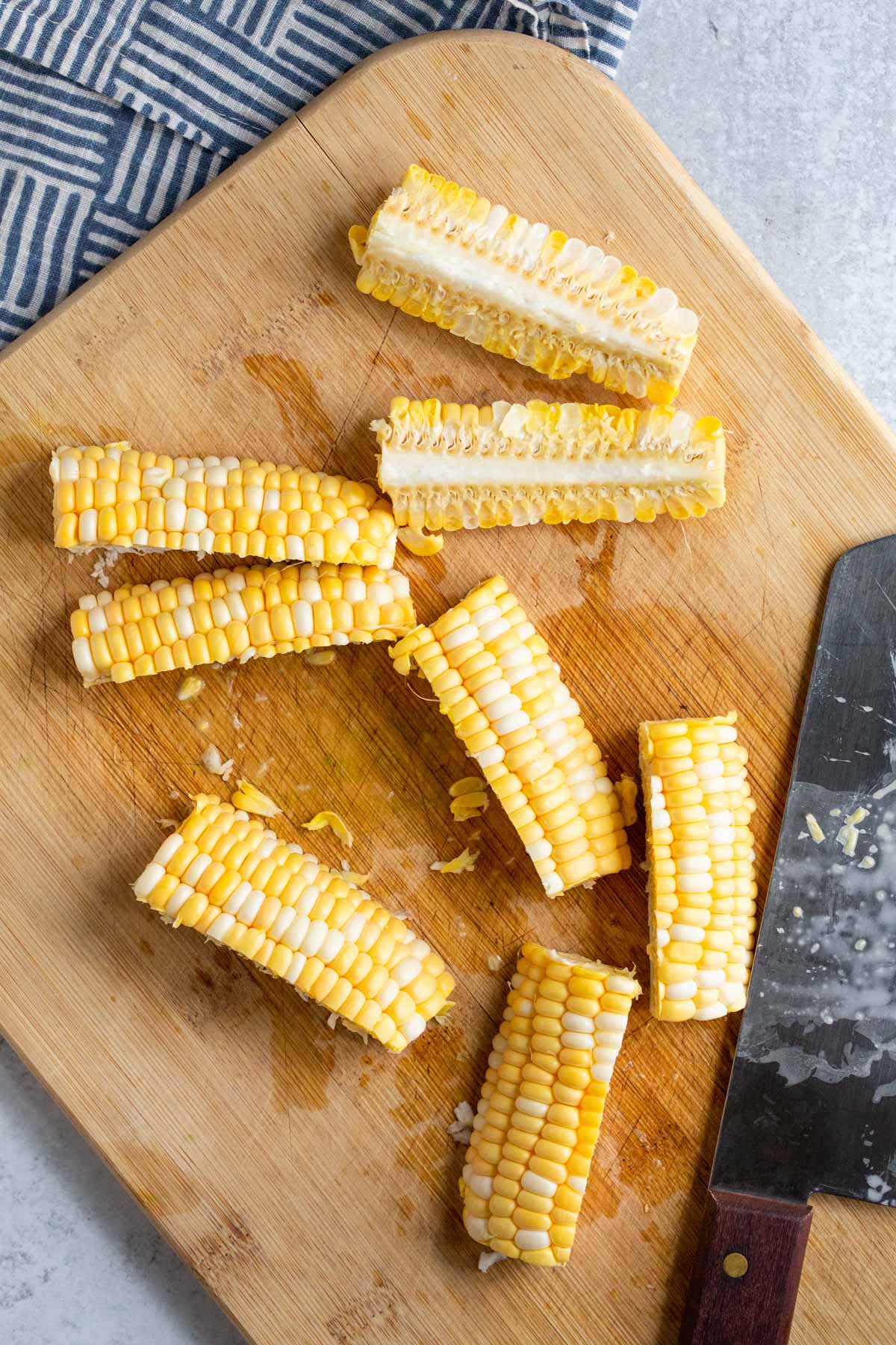 Cutting corn into ribs.