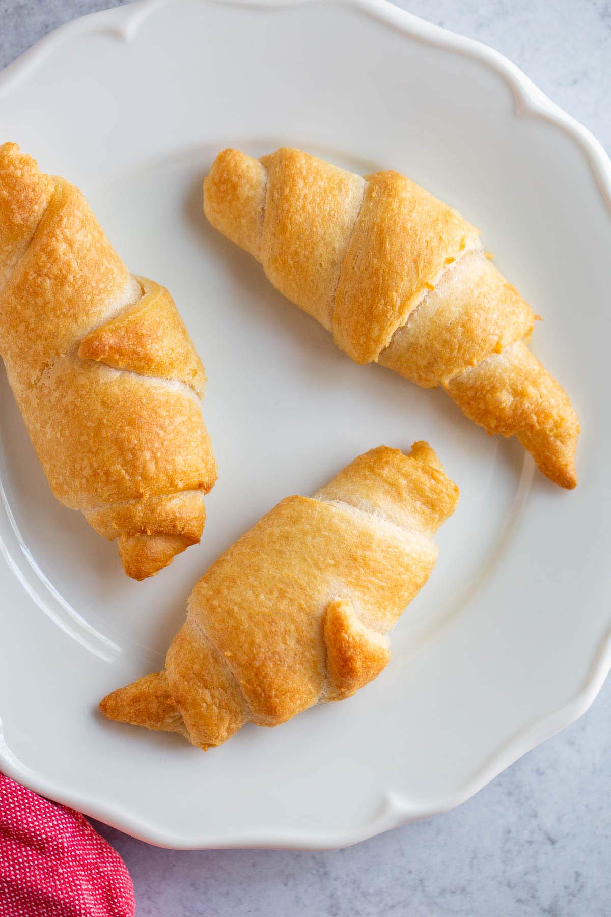 Air fried crescent rolls on a plate