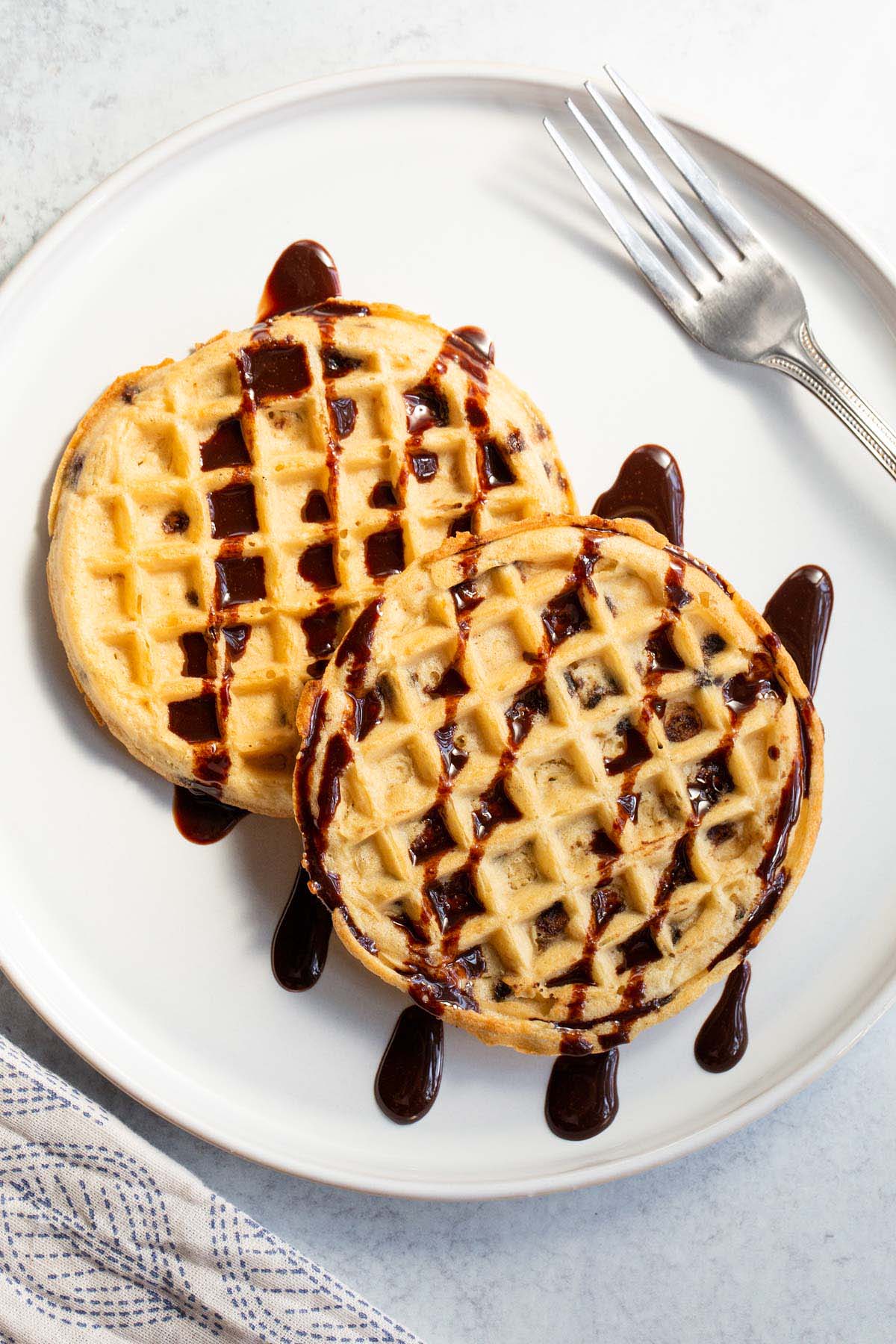 Waffles with chocolate syrup.