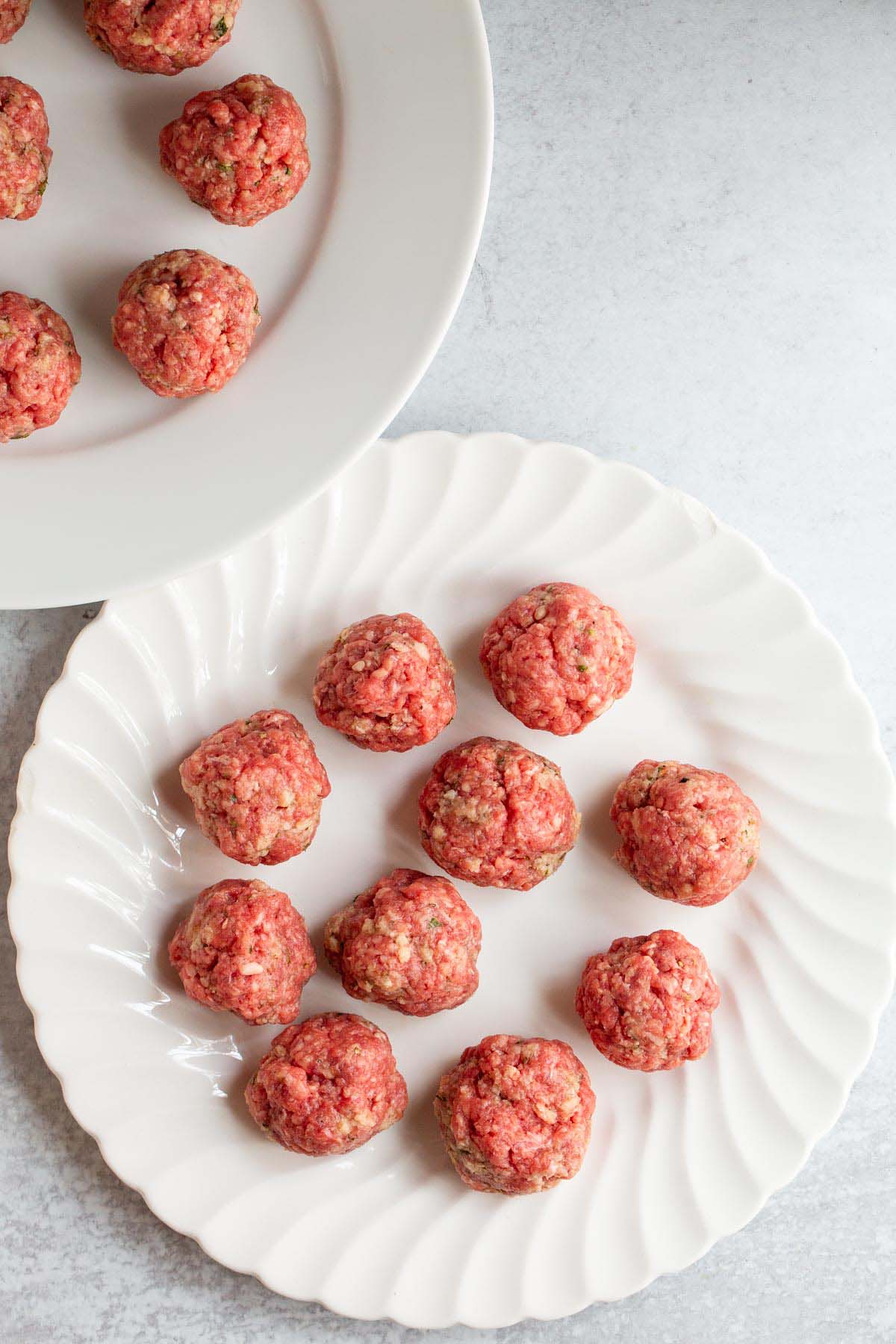 Uncooked meatballs.