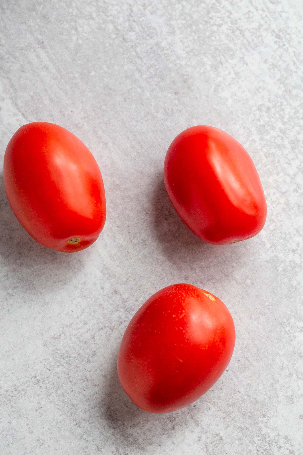 Three roma tomatoes