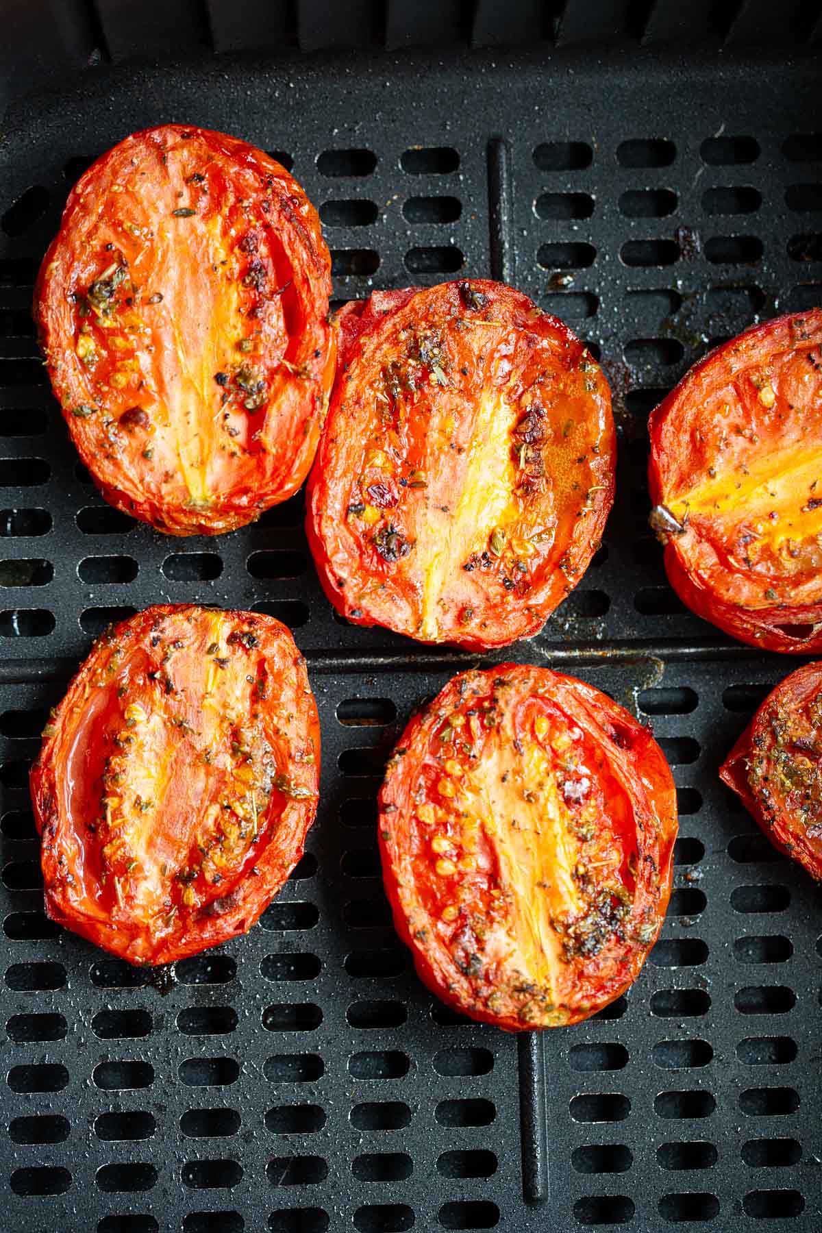 Roasted roma tomatoes in air fryer basket