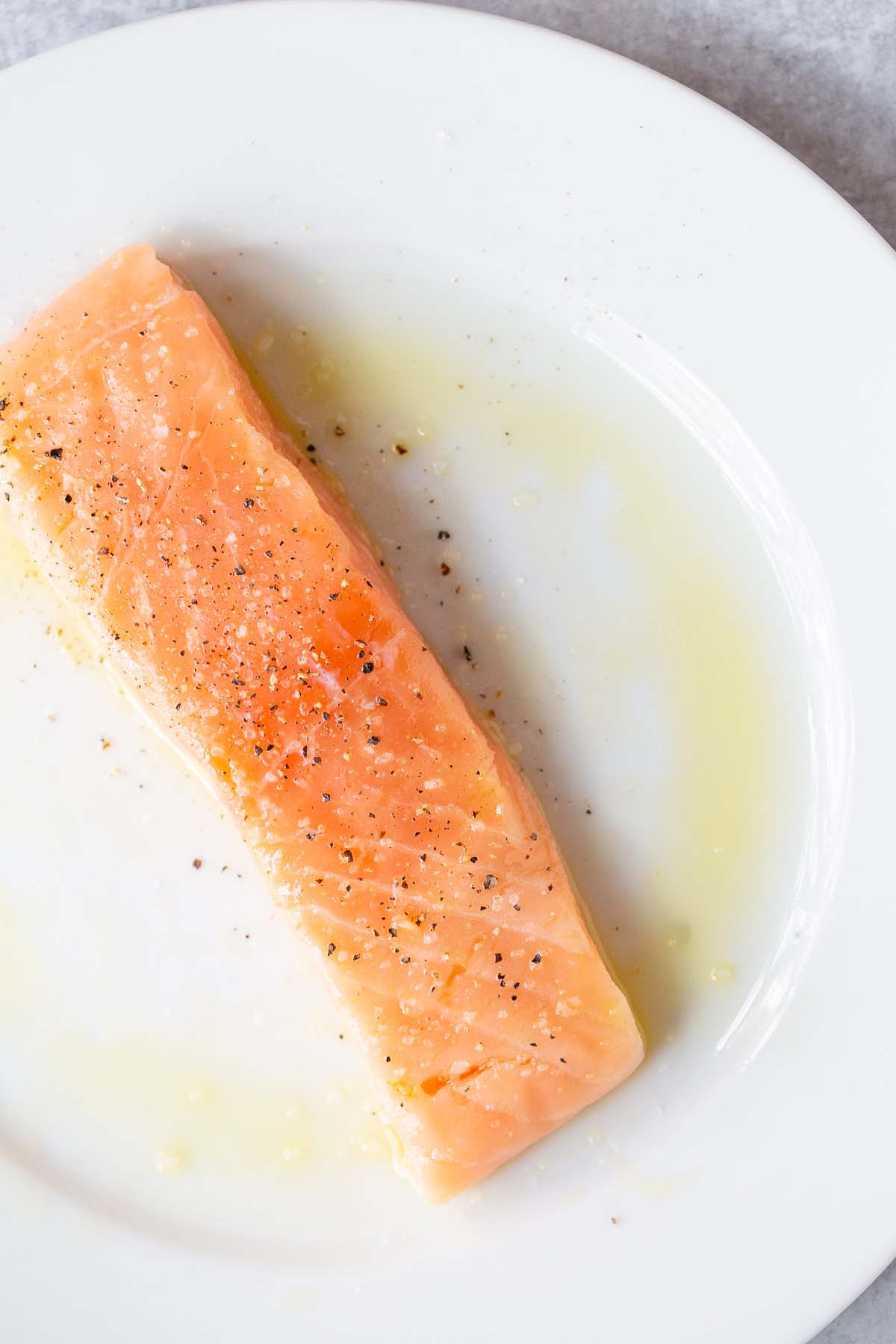 Salmon sprinkled with salt and pepper.