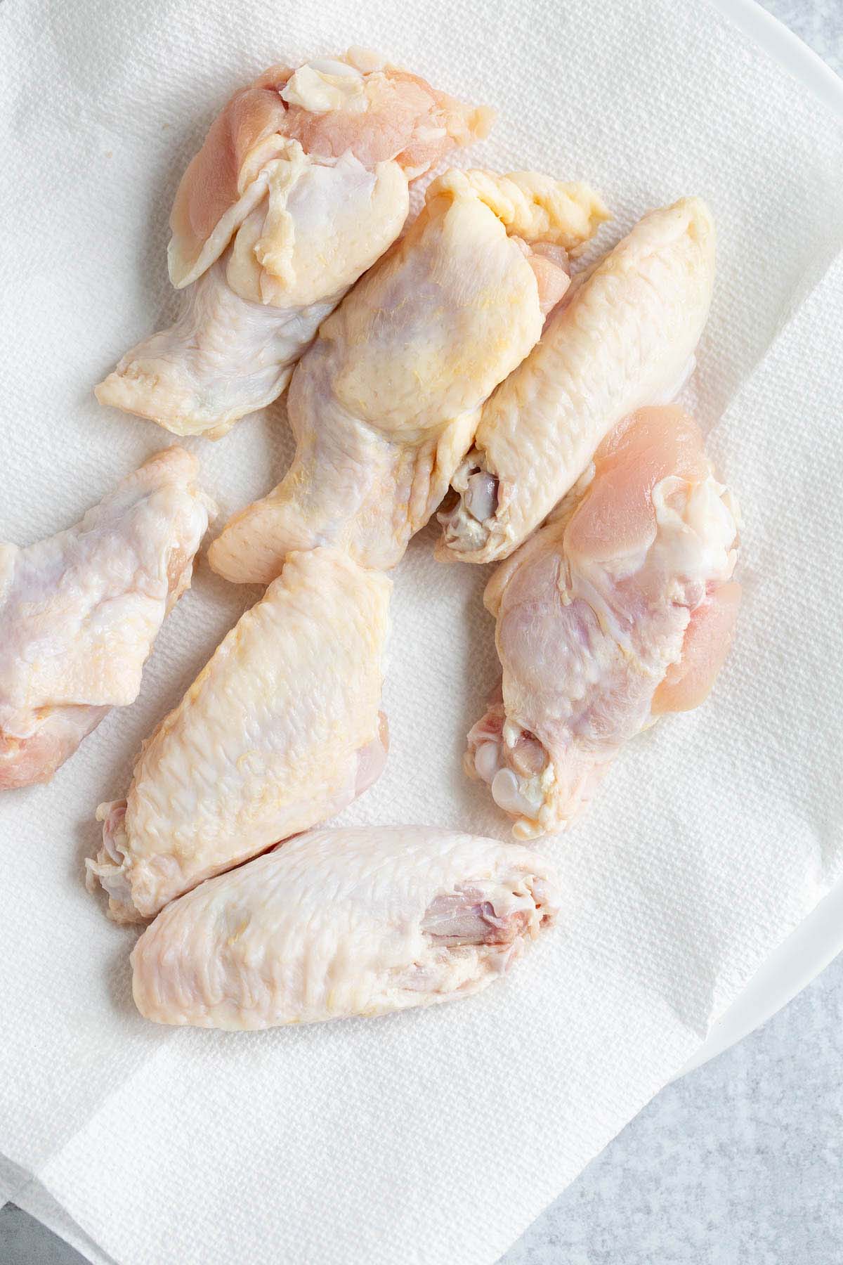 Uncooked chicken wings.