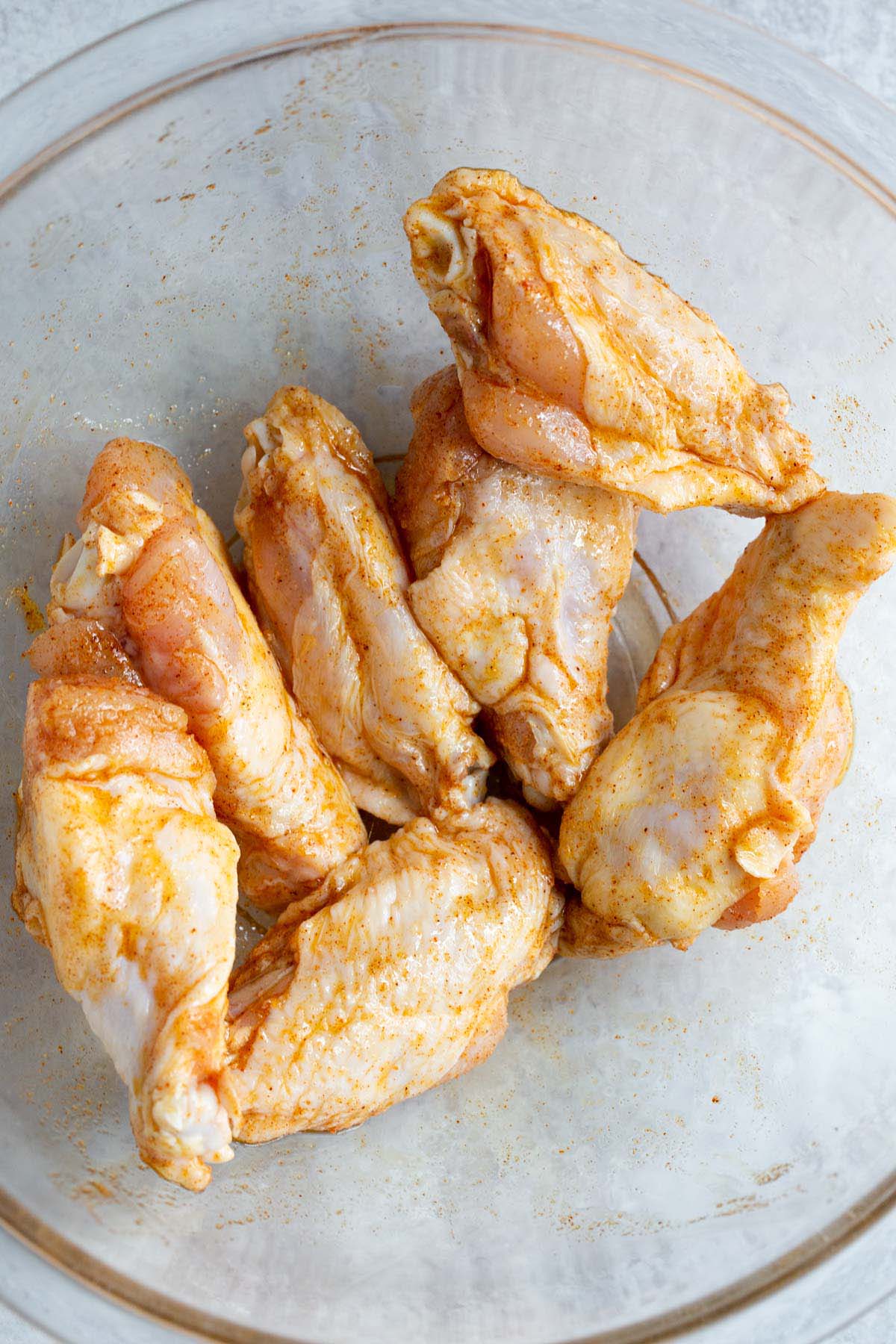 Chicken wings with seasonings.