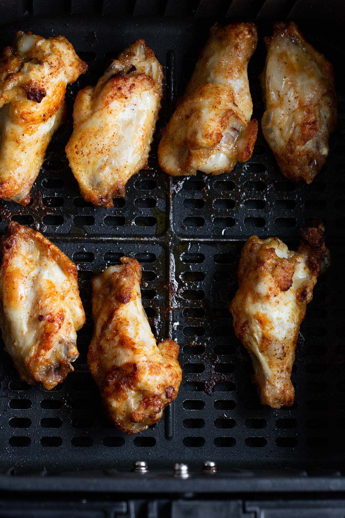 Cooked chicken wings in air fryer.