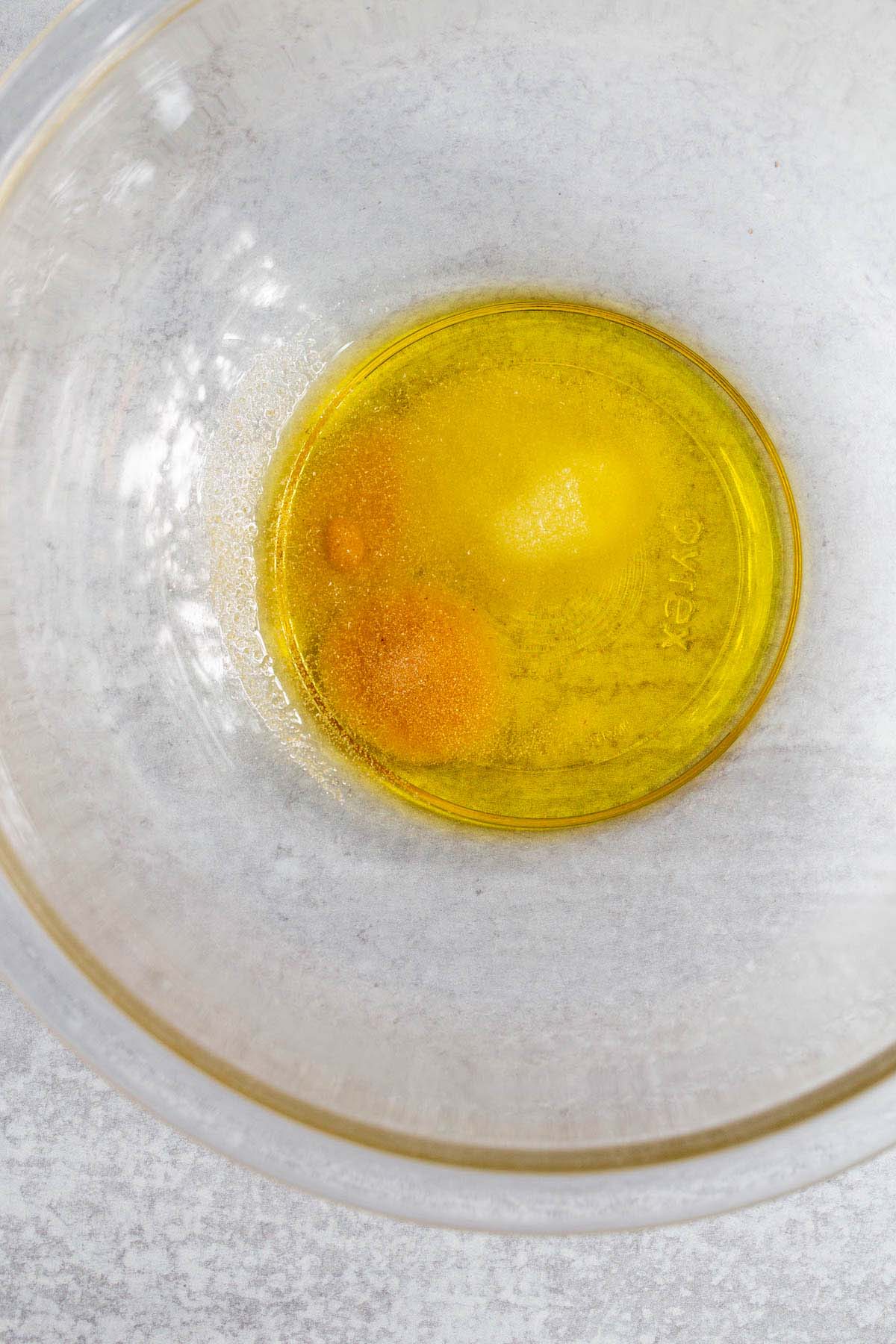 Oil and seasonings in a bowl.