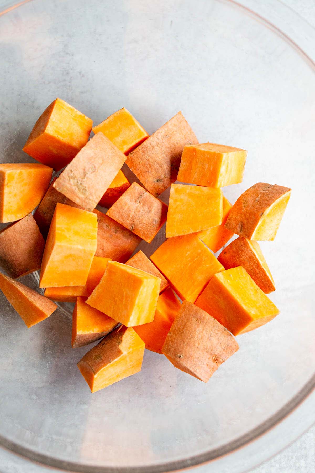 Raw sweet potato cubes in a bowl.