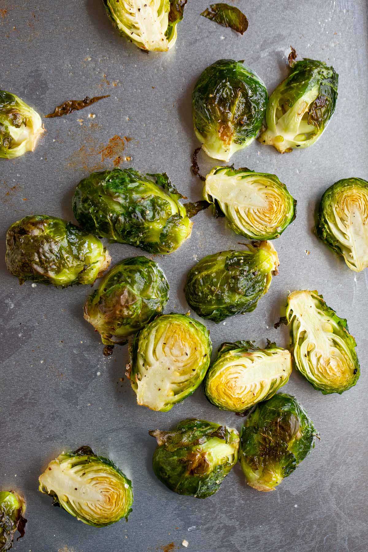 Roasted brussels sprouts on a baking sheet.