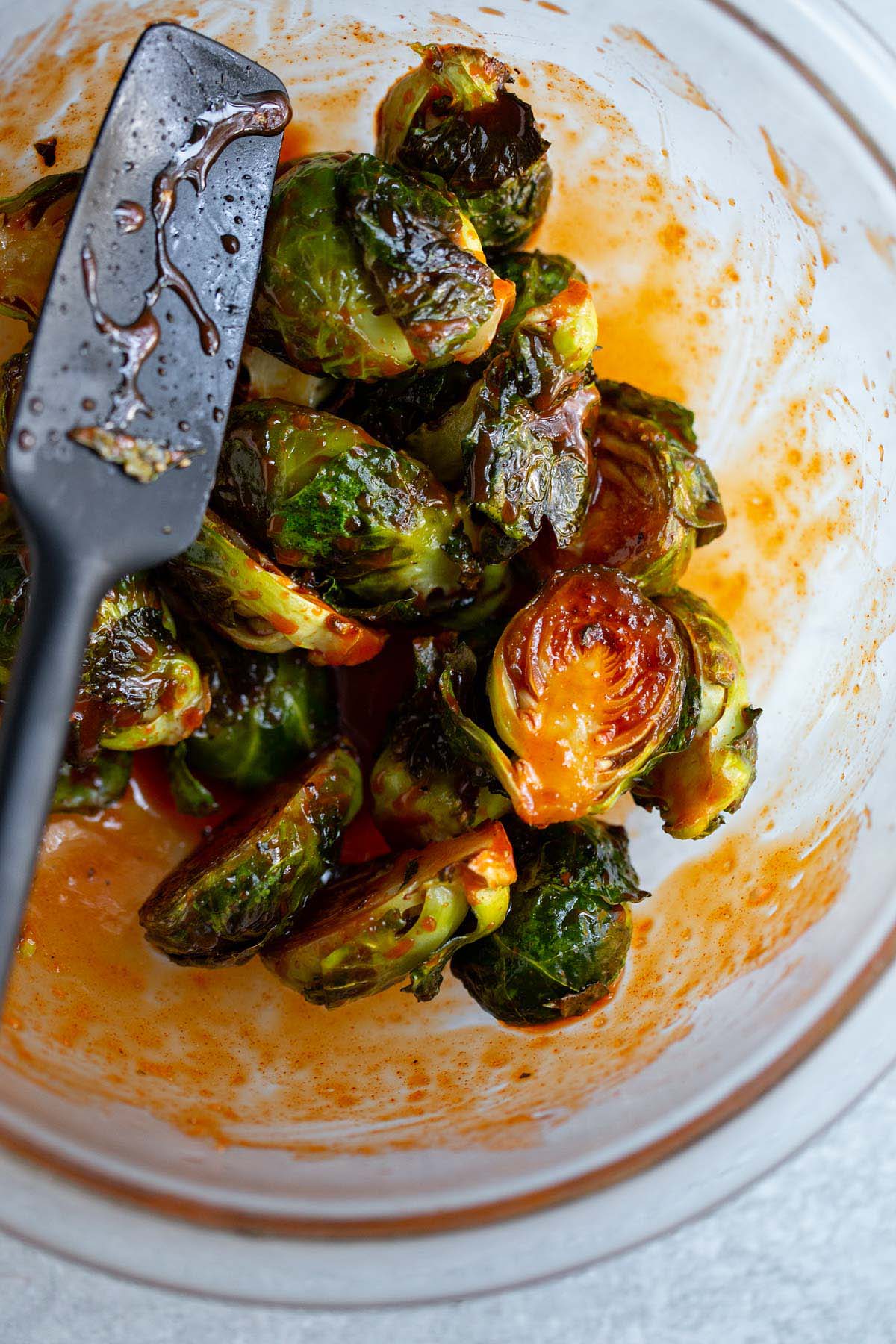 Brussels sprouts tossed with gochujang sauce.