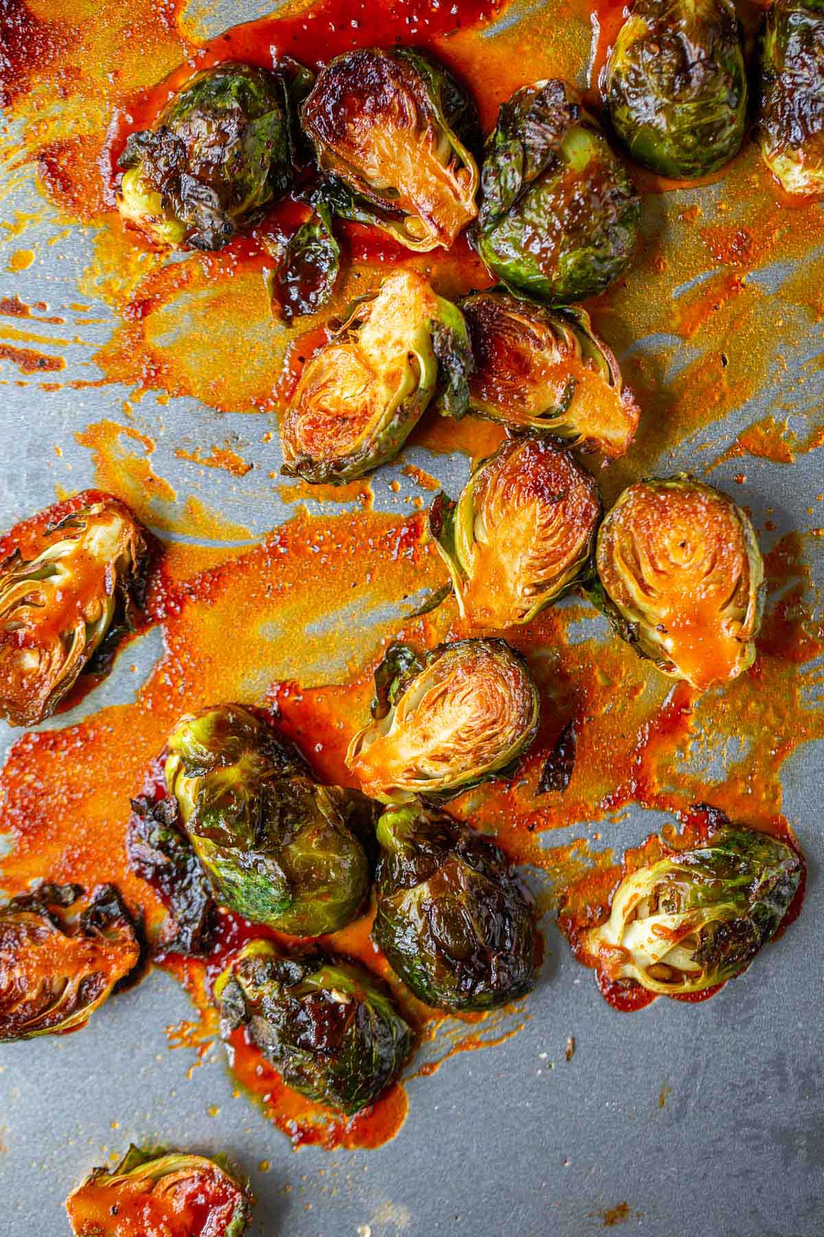Gochujang brussels sprouts on a baking sheet.