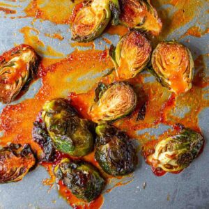 Gochujang brussels sprouts on a baking sheet.