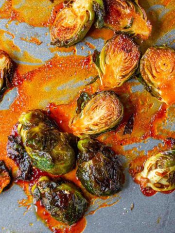 Gochujang brussels sprouts on a baking sheet.