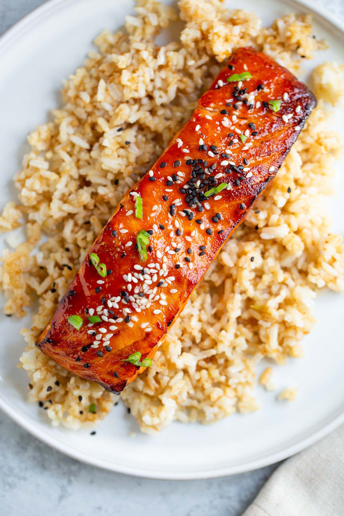 Air fried gochujang salmon on top of rice.