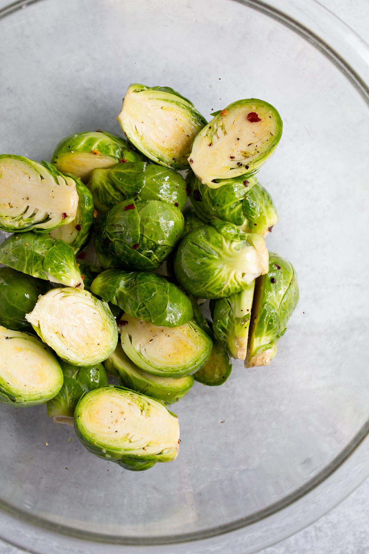 Halved brussels sprouts in a bowl.