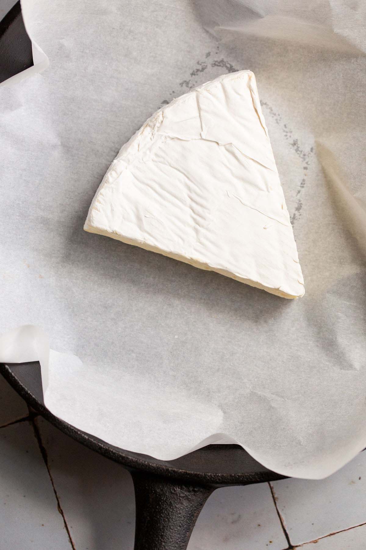 Uncooked brie wedge.