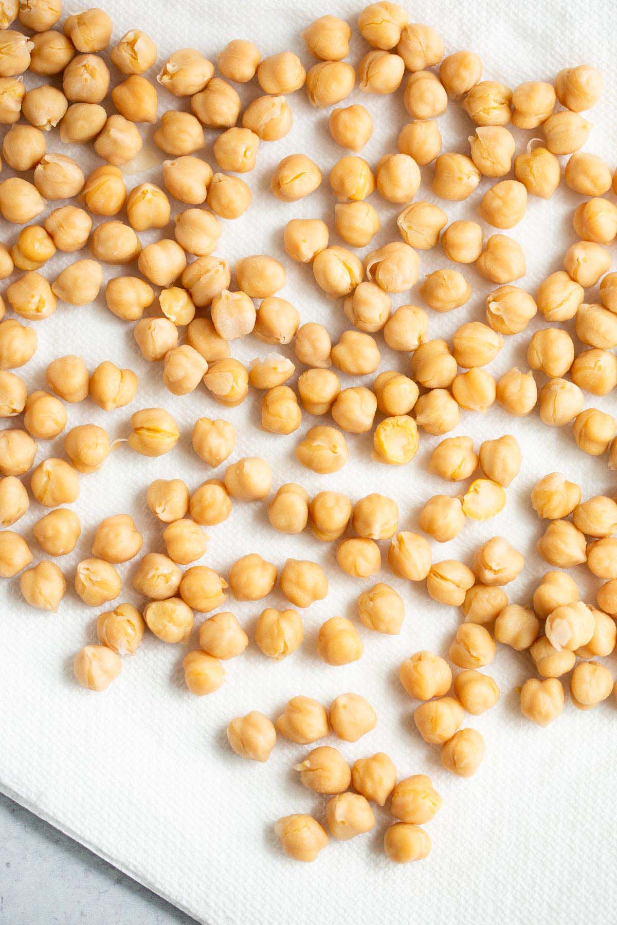 Chickpeas drying on a paper towel.