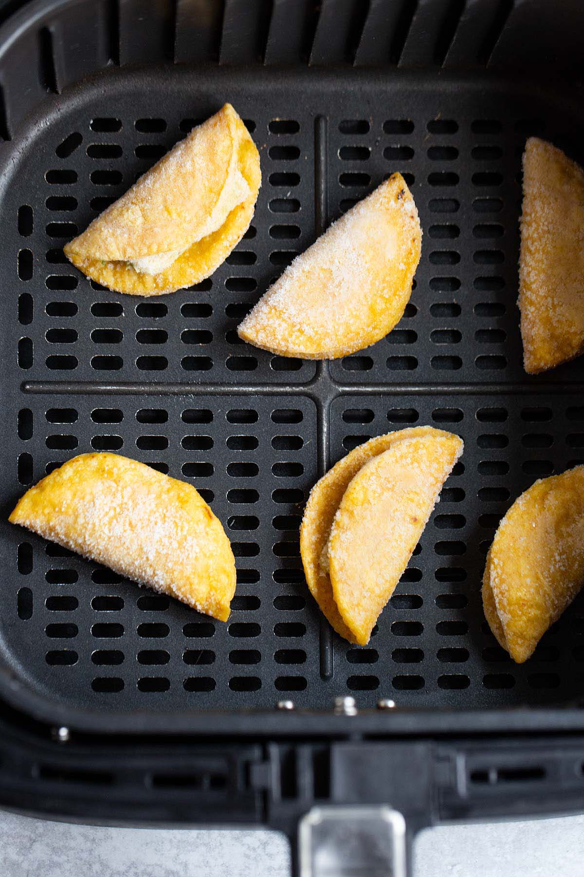 Frozen mini tacos in air fryer basket