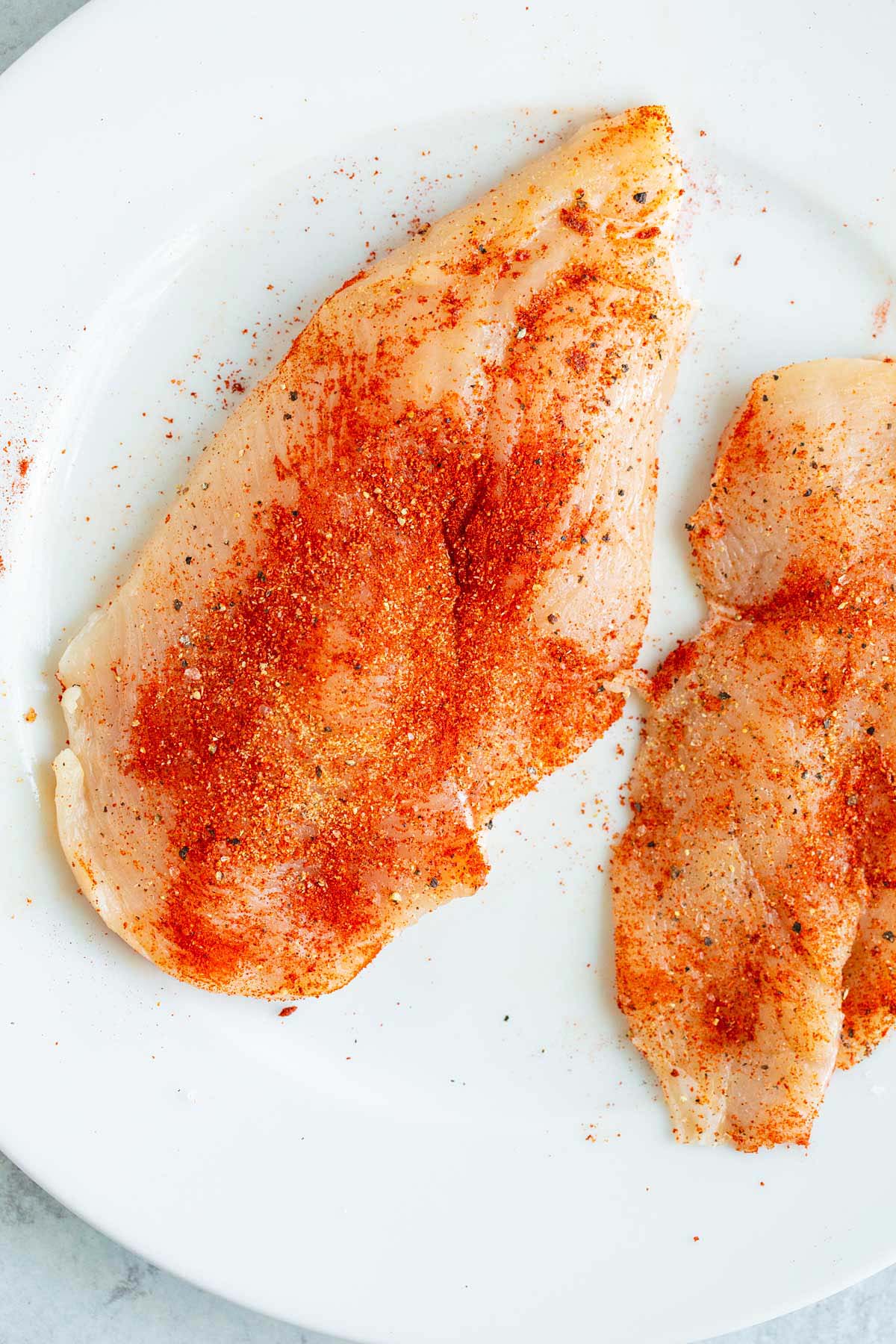 Chicken breasts with seasoning.