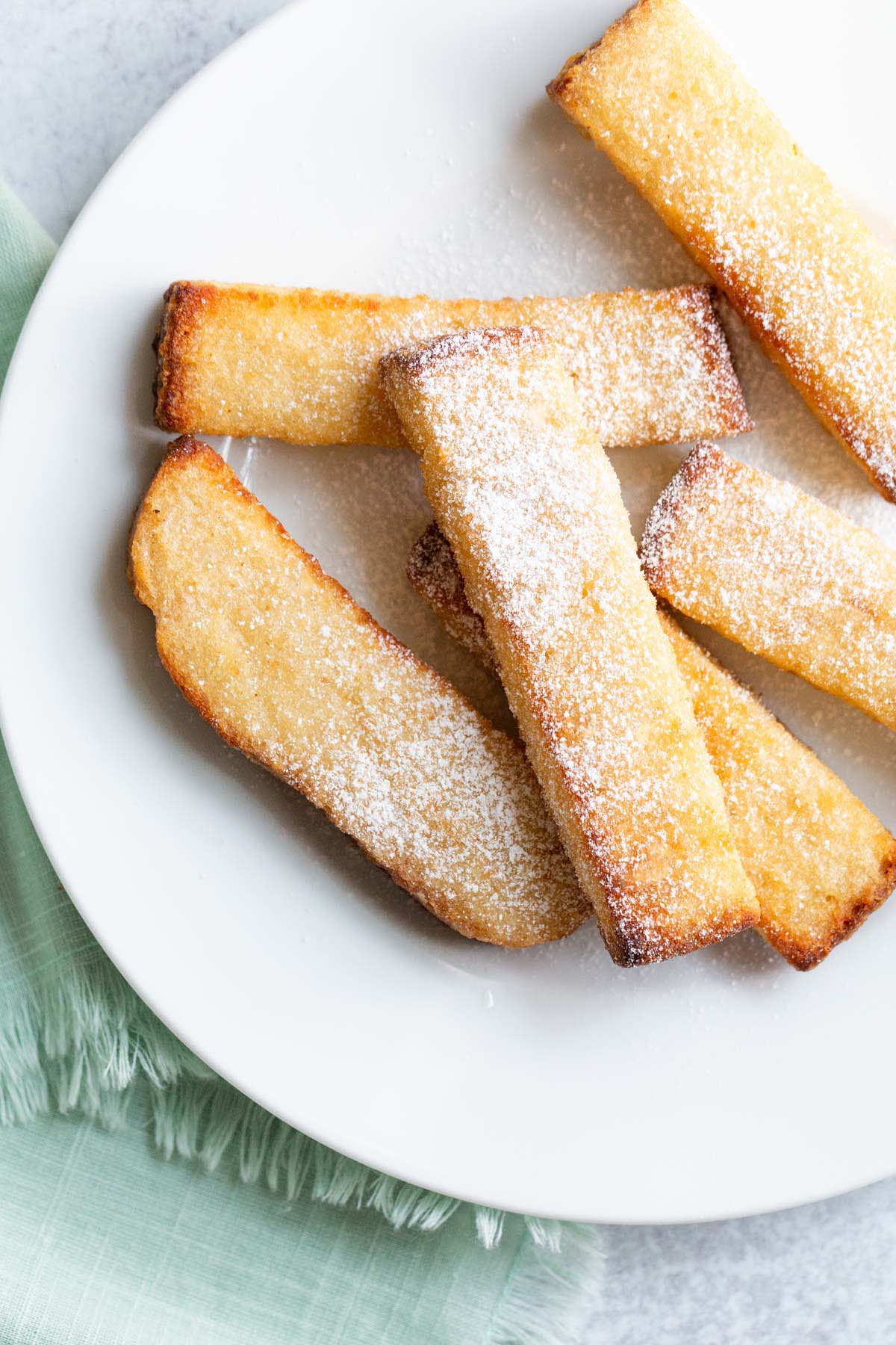 Air fried french toast sticks with powdered sugar.