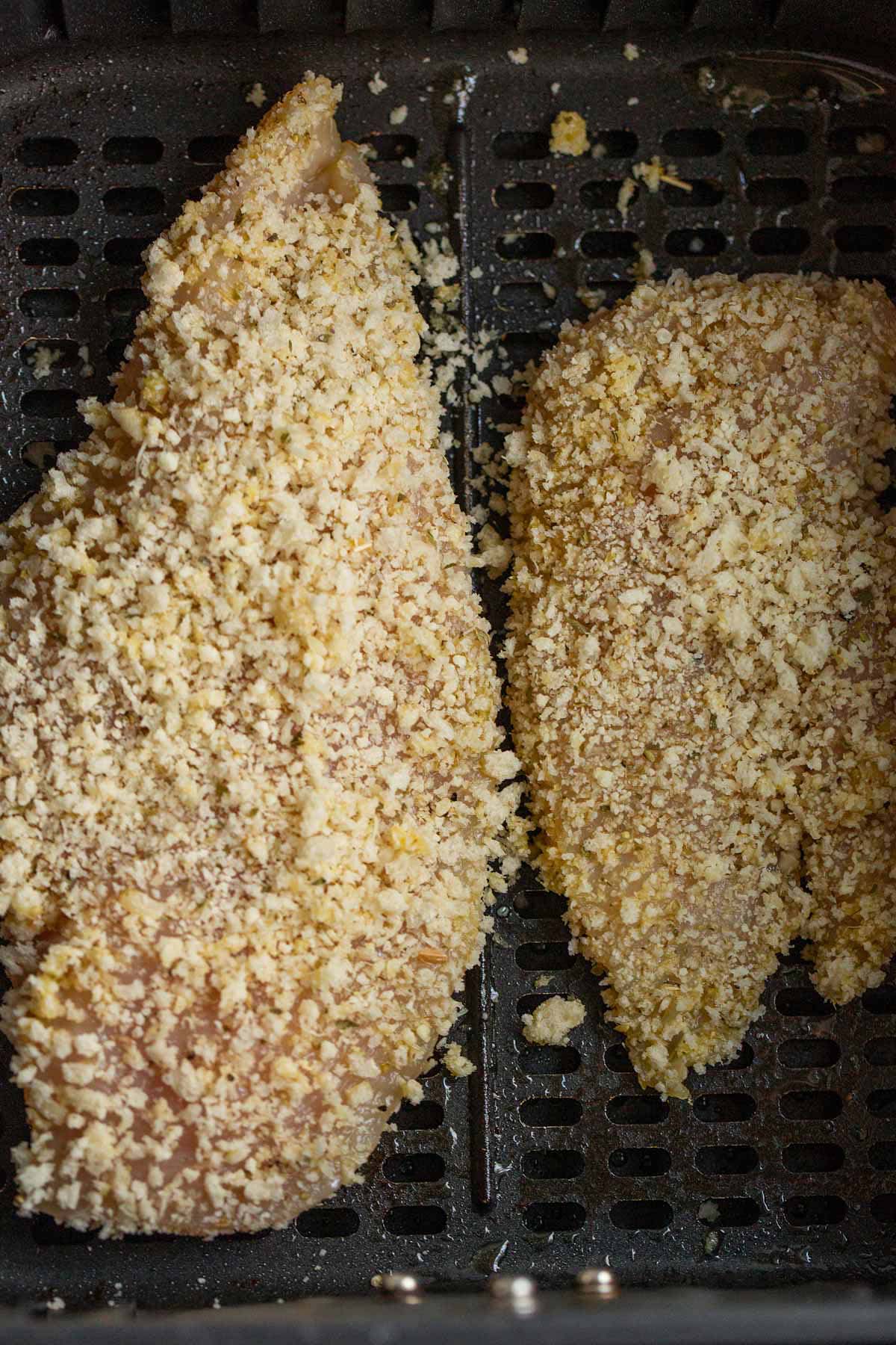 Uncooked air fryer parmesan crusted chicken.
