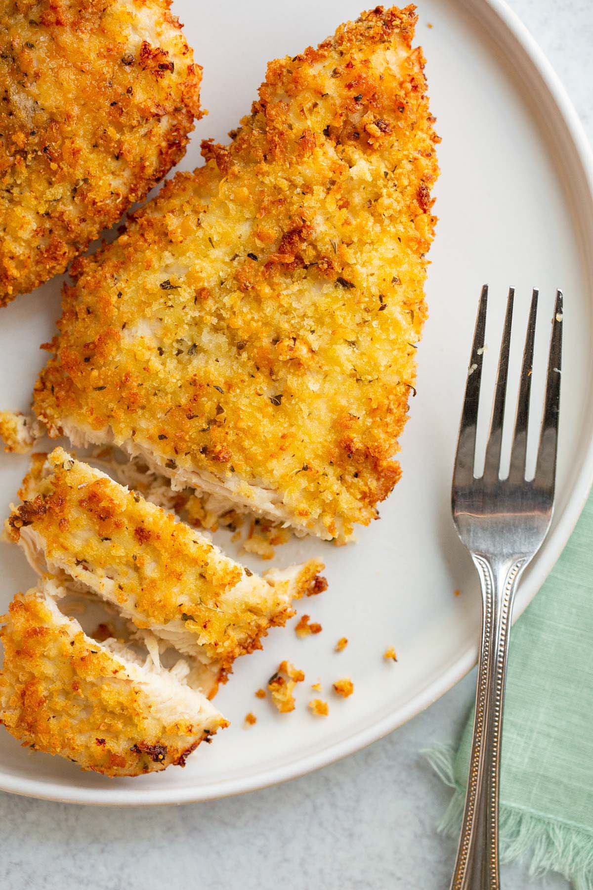 Sliced air fryer parmesan crusted chicken.