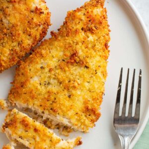 Sliced air fryer parmesan crusted chicken.