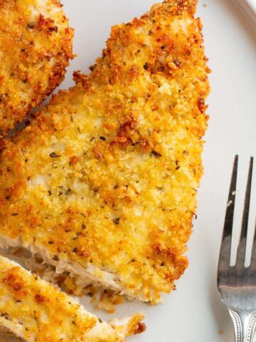 Sliced air fryer parmesan crusted chicken.