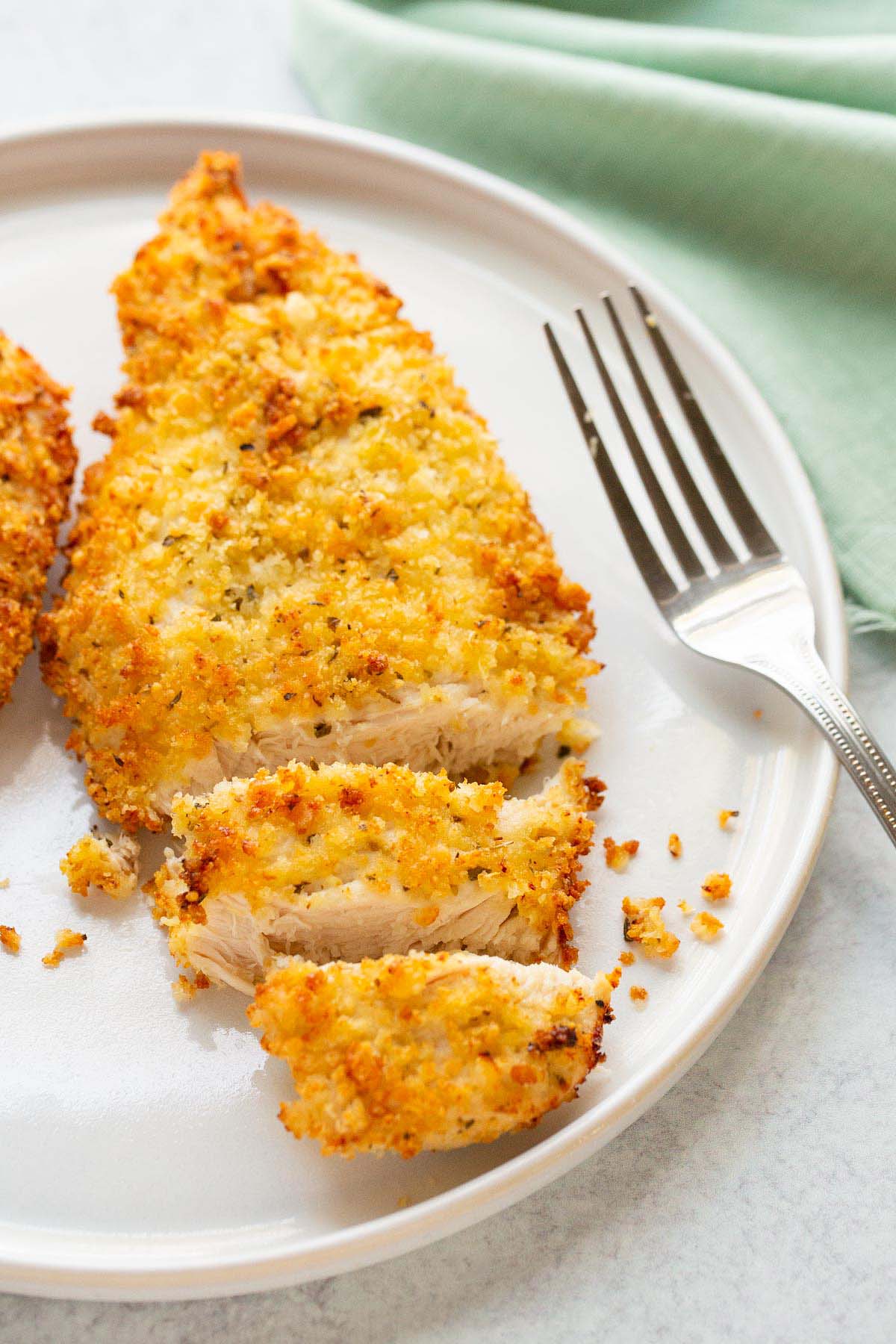 Sliced air fryer parmesan crusted chicken.