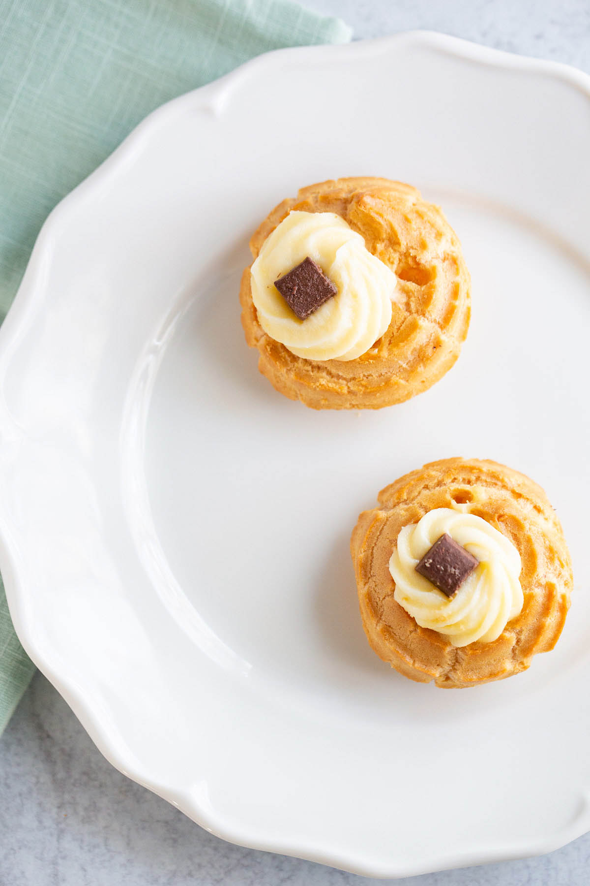 Cream puffs on a plate.