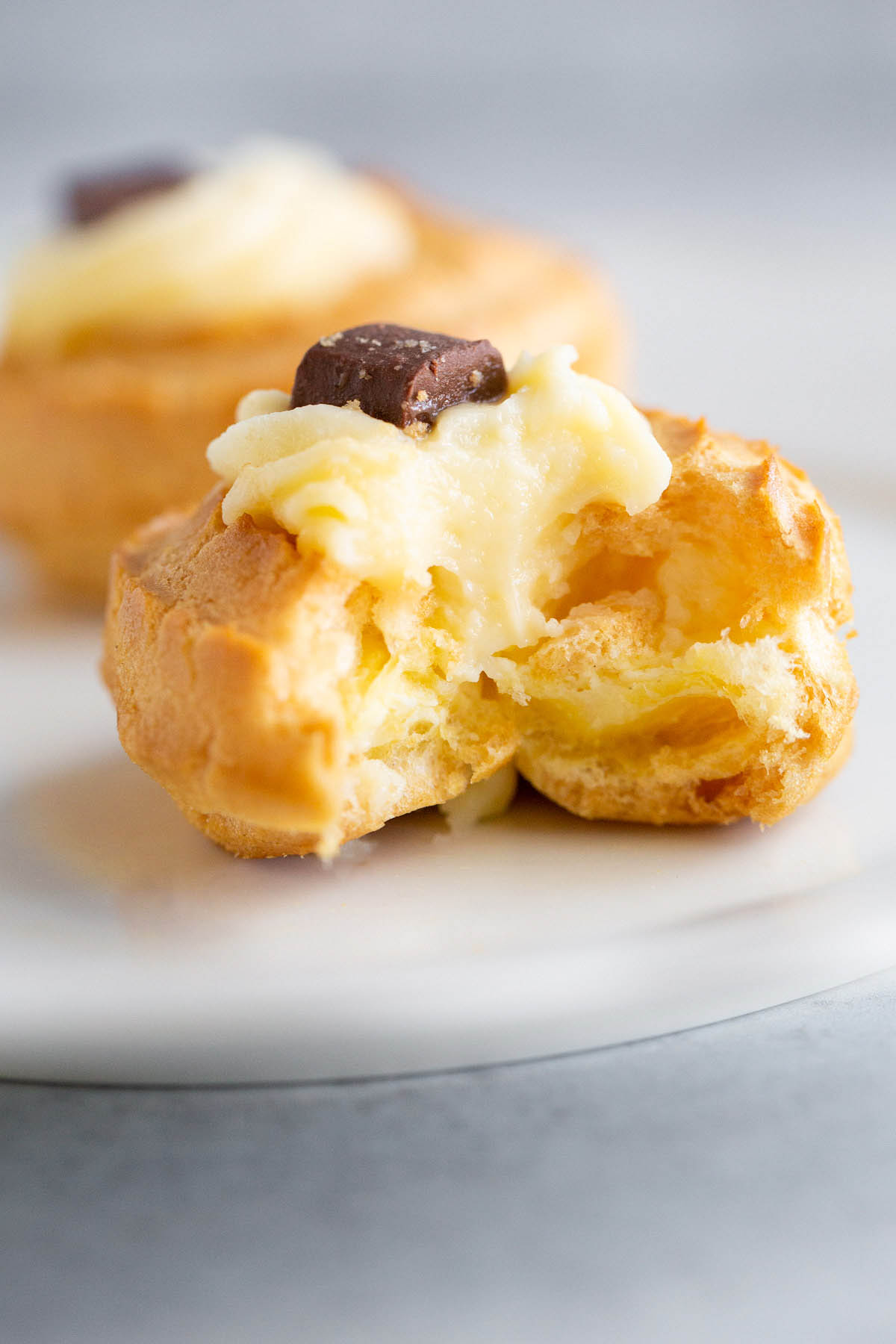 Cream puff with a bite taken out