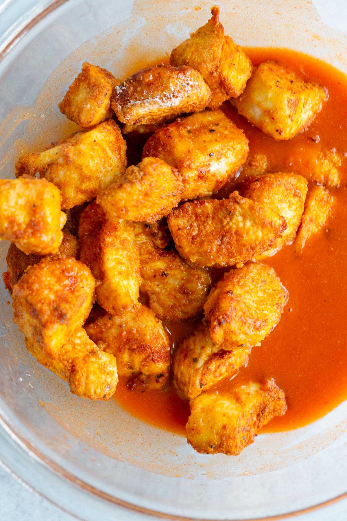 Chicken in a bowl with buffalo sauce