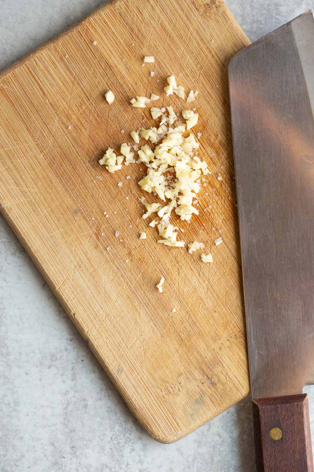 Minced garlic on a cutting board