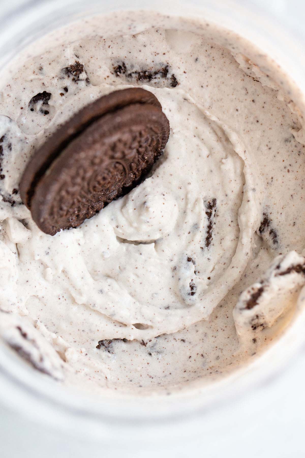 Ninja Creami cookies and cream ice cream with an oreo on top.